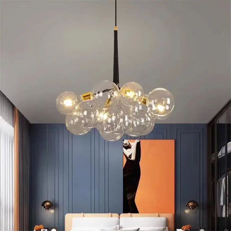 Modern brass bubble chandelier featuring a glass globe with golden accents and black hanging cord for bedroom lighting decorbites bubble chandelier
