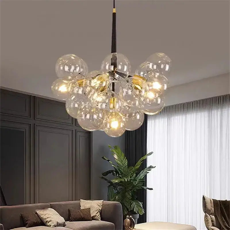 Modern brass bubble chandelier with glass bubbles gold accents and black rod ideal for bedroom lighting decorbites bubble chandelier