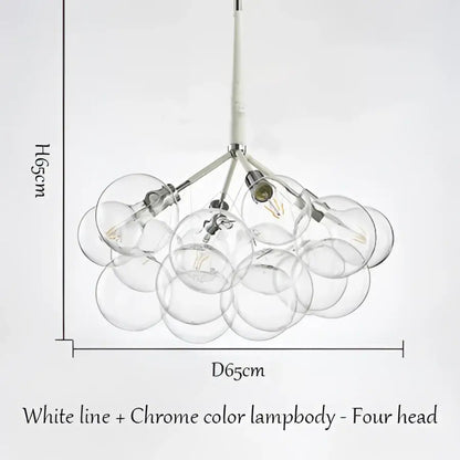 Modern brass bubble chandelier by decorbites with chrome lamp body and four clear glass globes for bedroom lighting