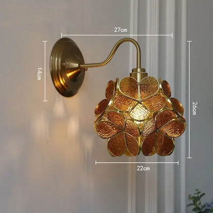 Modern brass butterfly wall sconce with amber-hued clear glass floral design for bedroom decorbites clear glass lighting