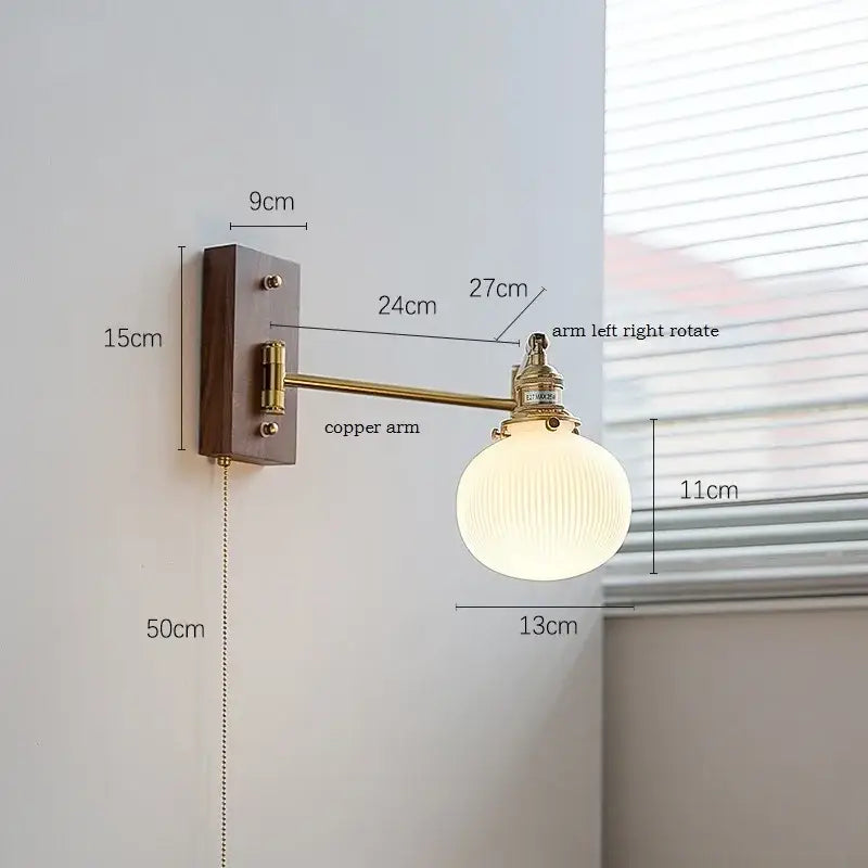 Modern brass canopy led wall light with dark wood base, brass copper arm, and off-white ribbed glass globe for bedroom decorbites canopy led