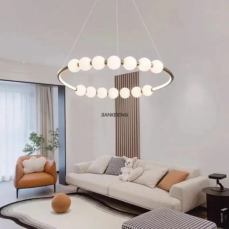 Modern brass circle ring led pendant light with gold-toned metal frame and frosted glass globes by decorbites circle ring