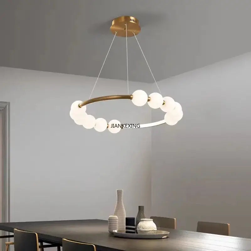 Modern brass circle ring led pendant light featuring a gold-toned frame with frosted glass globes for dining room decorbites circle ring