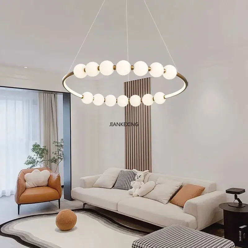 Modern brass circle ring led pendant light with sleek brass frame and frosted glass globe bulbs for dining room decorbites circle ring