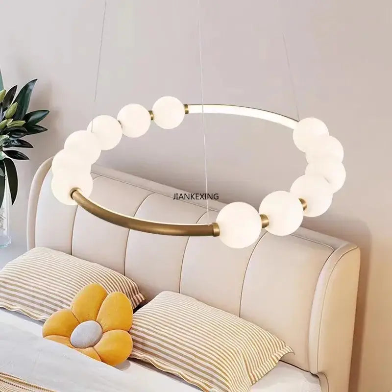 Modern brass circle ring led pendant light with frosted glass spheres and brass accents for dining room decorbites circle ring