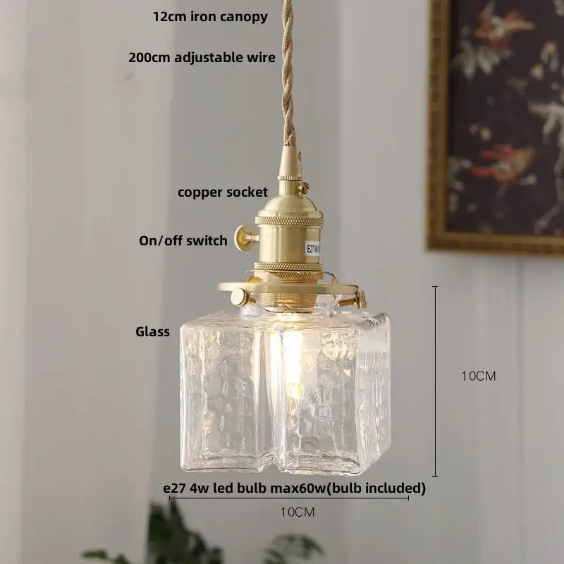 Modern brass clear glass led pendant light with textured glass and adjustable copper wire suspension for dining room decorbites