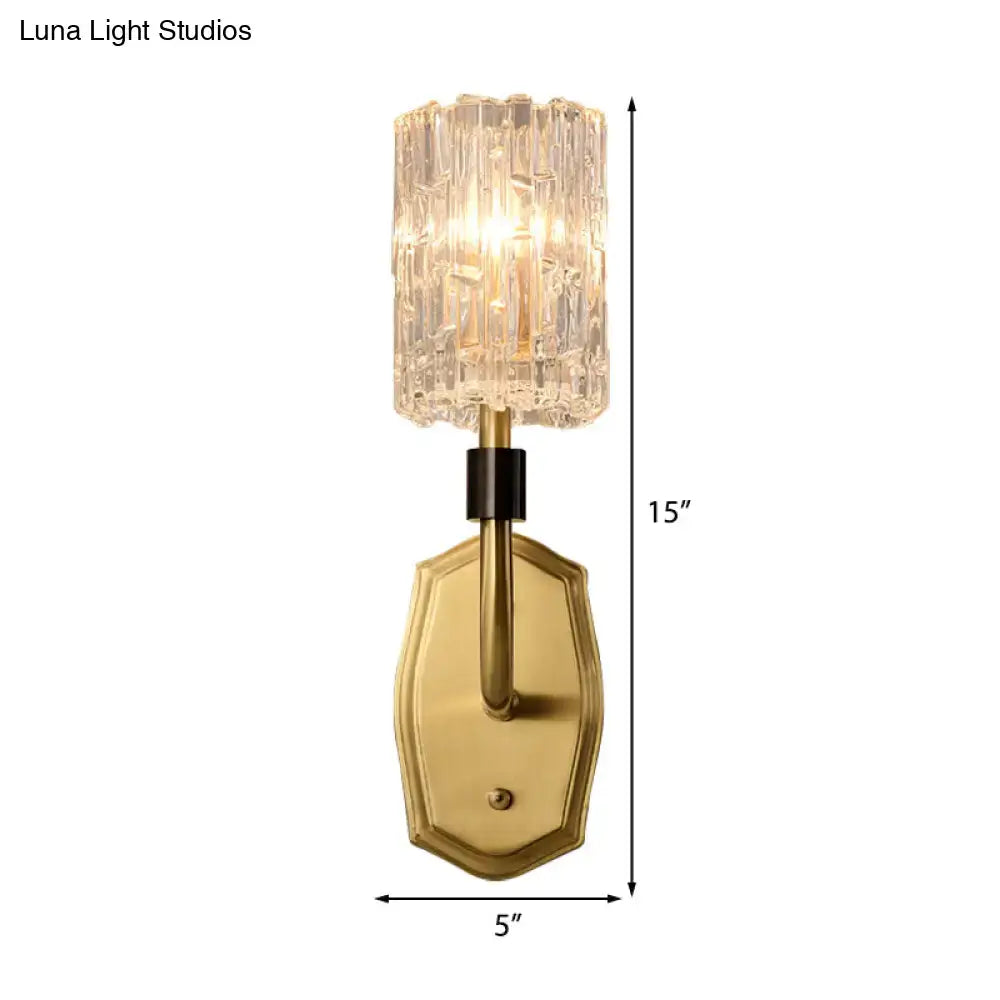 Modern brass clear glass living room wall sconce with gold-toned faceted crystal shade and black accent band inch fixture