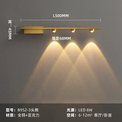Modern brass copper led wall lamp with gold finish, three circular bulbs, and sleek rectangular base for bedroom reading light