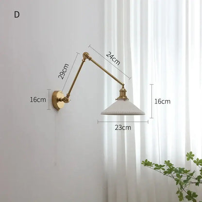 Modern brass copper swing arm wall sconce with brass finish and white ceramic shade for elegant bedroom decorbites copper swing
