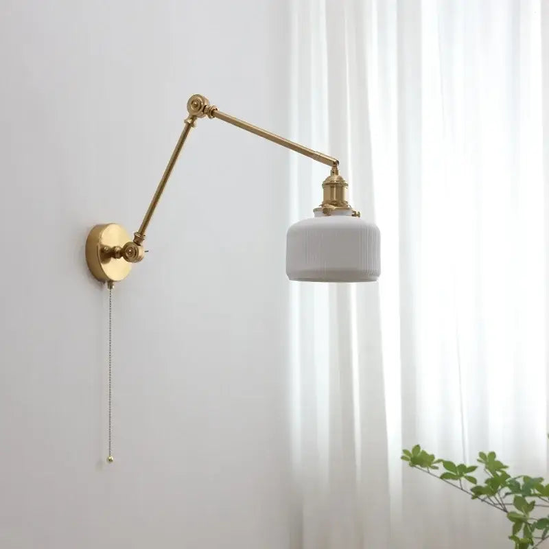 Modern brass copper swing arm wall sconce with gold finish and white ribbed glass shade for bedroom decorbites copper swing