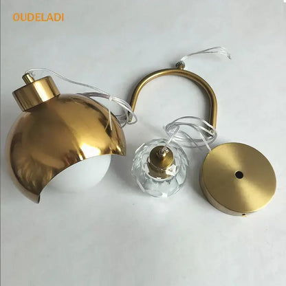 Modern brass crystal ball pendant light featuring gold-toned spherical shade and crystal accent for bedroom decorbites pendant lights