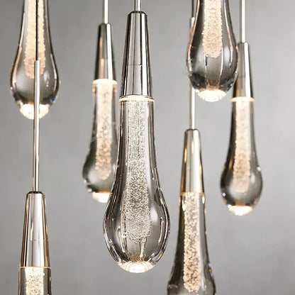 Modern brass crystal ceiling pendant light with clear glass teardrop and silver metallic caps for dining room decorbites brass crystal