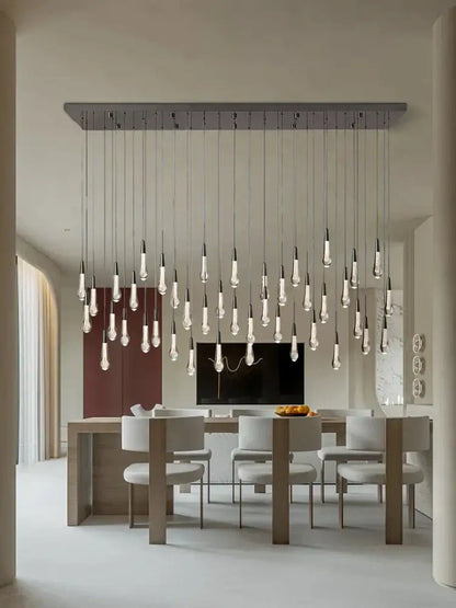 Modern brass crystal ceiling pendant light with clear glass bulbs on sleek metallic bar for dining room decorbites brass crystal