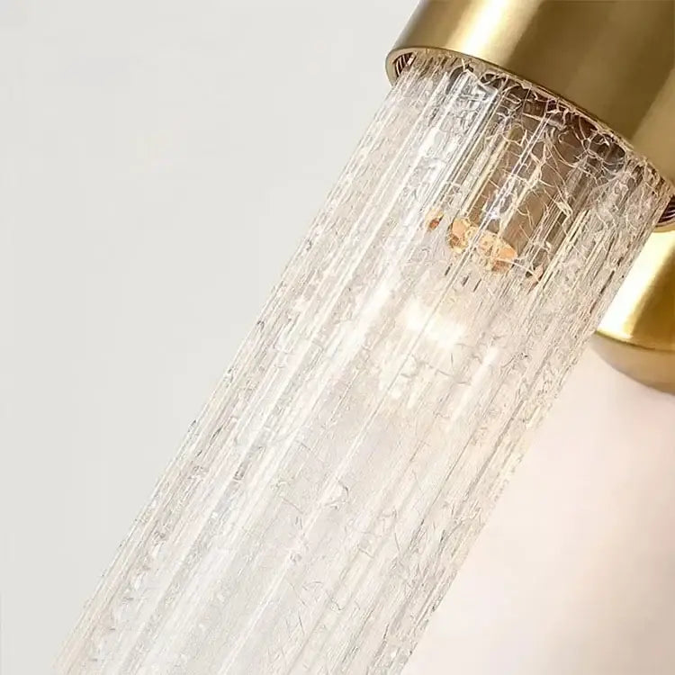 A modern brass crystal led wall lamp with a textured clear glass shade featuring vertical ridges for bedroom decorbites crystal led wall use