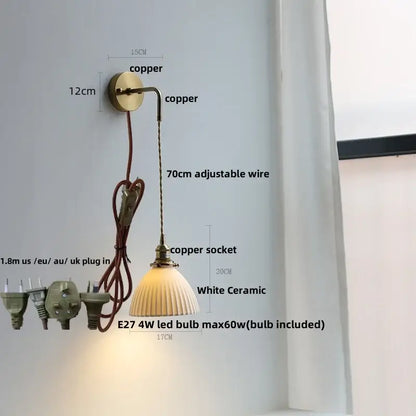 Modern brass crystal wall lamp featuring a copper finish with white ceramic fluted shade and adjustable wire for bathroom mirror lighting decorbites clear glass