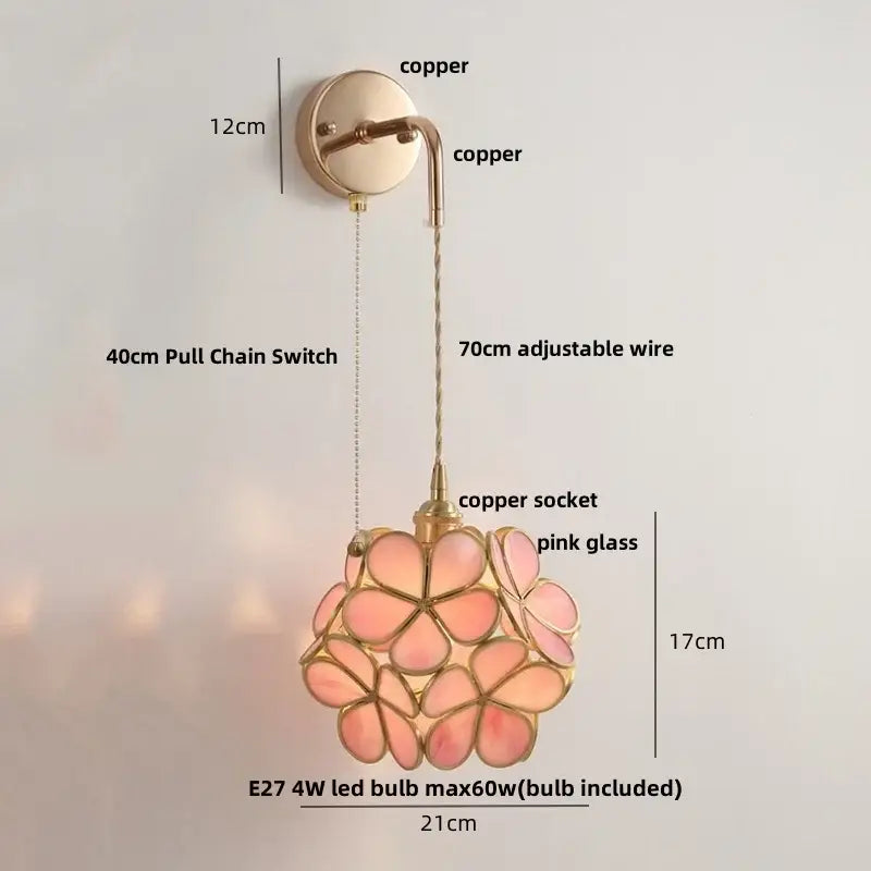 Modern brass cube led wall lights featuring a delicate pink glass flower pendant with copper accents and adjustable wire