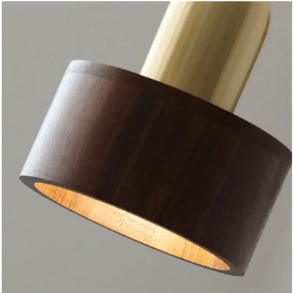 Dark wood cylindrical pendant light with brass finished top and inner lining for modern dining room decorbites led wood pendant