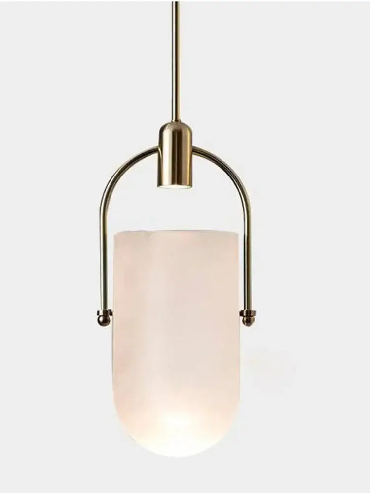 A modern decorbites bucket chandelier with a brushed brass frame and frosted glass shade for dining room lighting