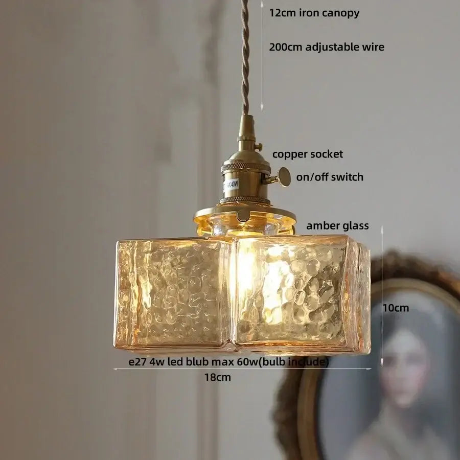 Modern brass decorbites cube amber glass pendant lamp with textured amber glass and brass-finished copper socket for dining room