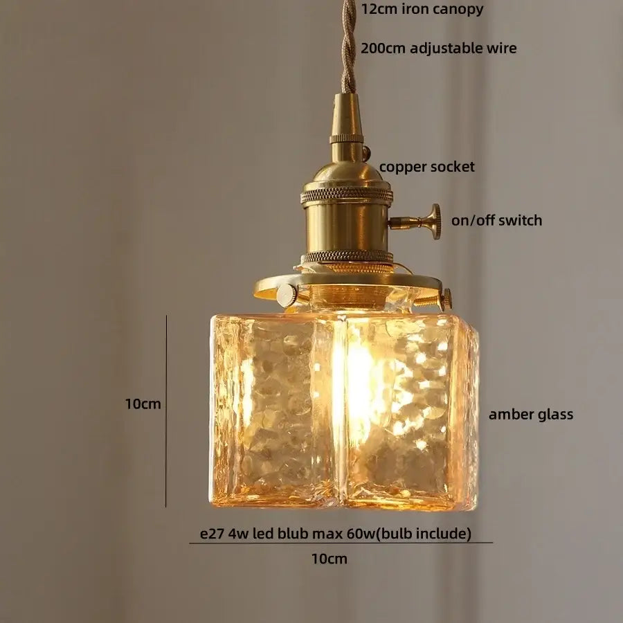 Modern brass decorbites cube amber glass pendant lamp with textured faceted glass and brass-finished socket for dining room