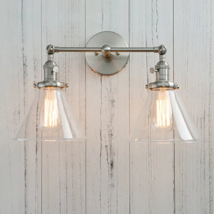 Stylish brushed nickel two-light wall sconce with clear decorbites funnel glass shades for bedroom light fixture