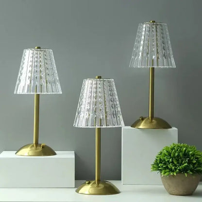 Three elegant modern brass diamond touch desk lamps with clear faceted glass shades for bedroom lighting