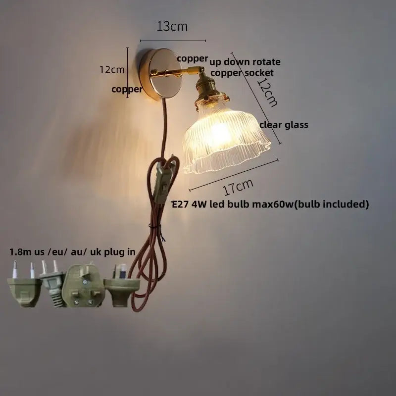 Modern brass floral clear glass wall sconce with copper up-down rotating socket and clear glass shade by decorbites wall sconce