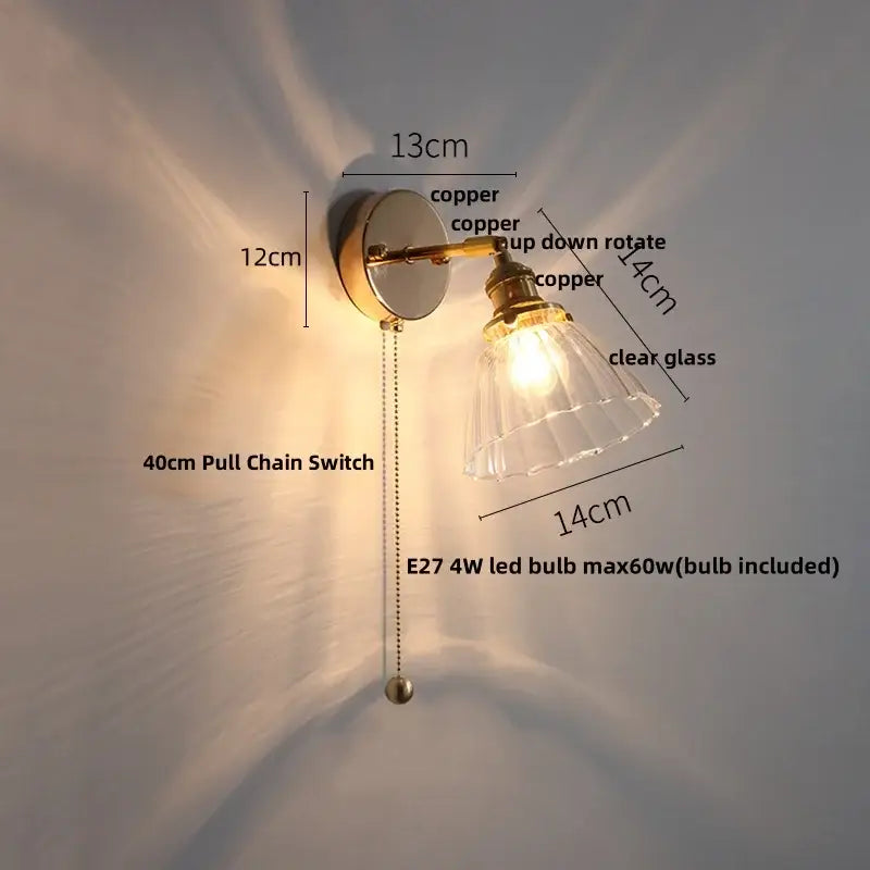 Modern brass floral clear glass wall sconce with copper finish and clear glass shade featuring an e27 led bulb by decorbites clear glass
