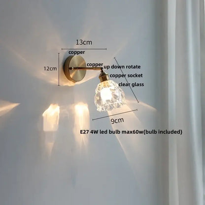 Copper wall sconce with clear glass shade featuring decorbites glass base led design for modern bedroom lighting