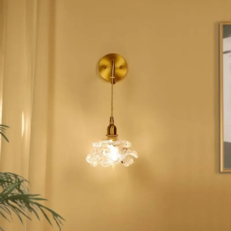 Modern brass flower glass led wall sconce with a gold-toned frame and faceted crystal shade for warm bedroom decorbites led wall lighting