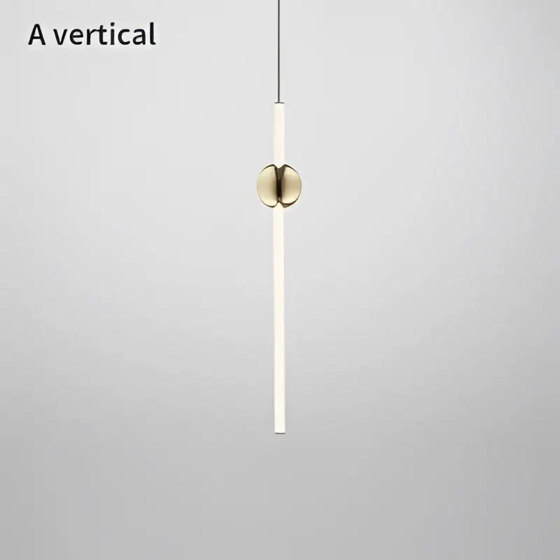 A sleek modern brass geometric glass pendant light with white cylindrical body for dining room lighting