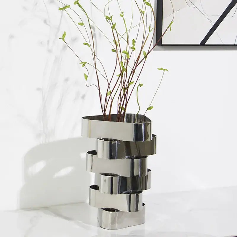 Modern silver metallic decorbites geometric vase with stacked interlocking ring design for living room decor