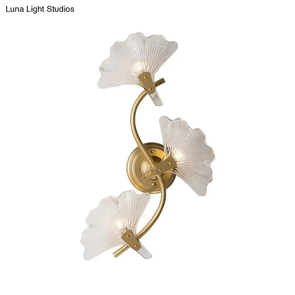 Modern brass ginkgo leaves wall light with gold-toned metal and three translucent fan-shaped glass shades for bedroom use