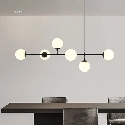 Modern black metal chandelier with six frosted glass globes featuring brass glass ball accents for living room decorbites brass glass