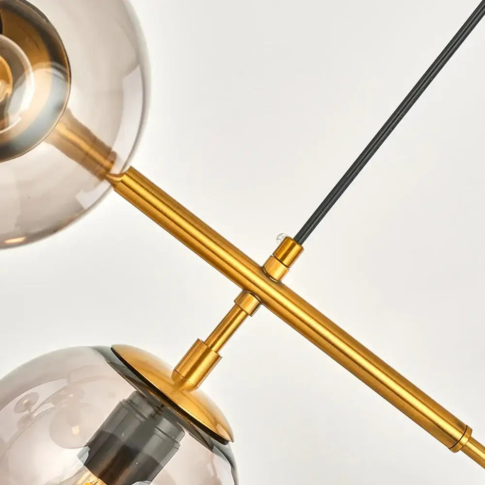 Modern brass glass ball led chandelier with smoked glass globe shades and black cable for dining room decorbites glass ball design