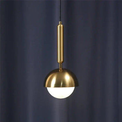 A modern brass glass ball led pendant chandelier with a polished stem and dome shade for dining room decorbites decor