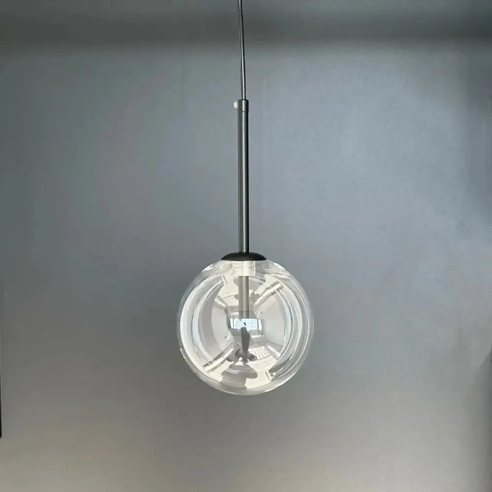Modern brass glass ball led pendant lamp featuring a clear glass ball led with sleek metallic rod for living room decorbites lighting