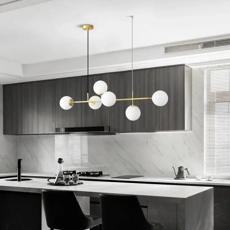 Modern pendant light with gold-toned metal frame and five white glass ball led shades for living room decorbites glass ball