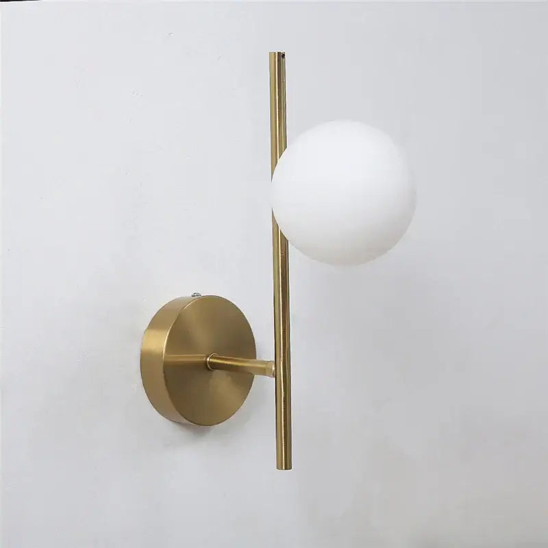 Modern brass glass ball led wall light with gold-toned vertical rod and frosted white spherical glass shade for bedroom decorbites glass ball