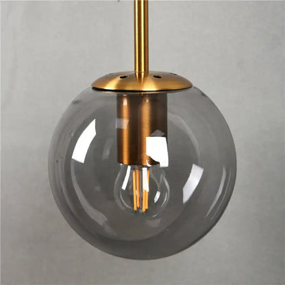 Modern brass glass ball led wall light with translucent gray glass globe and exposed filament bulb for bedroom decorbites glass ball