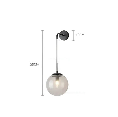 A sleek black metal wall light with frosted glass ball led and exposed bulb measuring 58cm in height