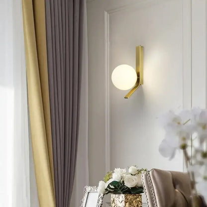 Modern brass glass ball led wall sconce with gold-toned metal and frosted glass shade for bedroom decorbites wall sconce