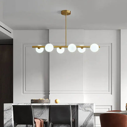 Modern brass glass ball pendant chandelier dining room light with gold-toned linear design and five frosted glass globes decorbites glass ball