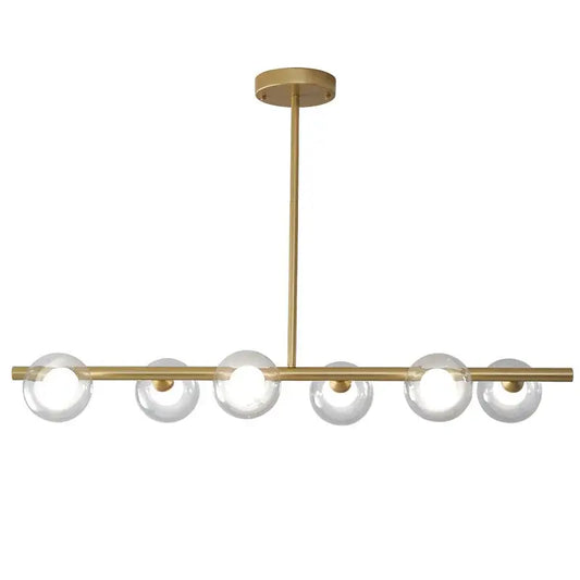 Modern brass glass ball pendant chandelier with six clear glass globe bulbs in a linear design for dining room decorbites glass ball