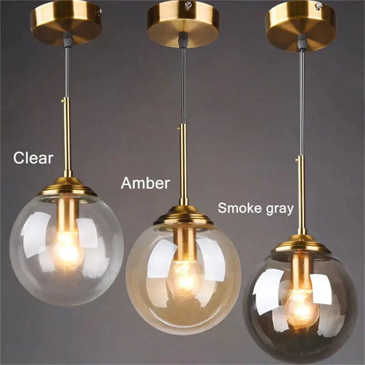 Three modern brass glass ball pendant lights with clear amber and smoke gray shades for dining room decorbites glass ball pendant