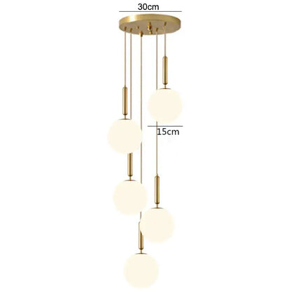 Modern brass glass ball pendant lights with five frosted glass spheres and gold-toned rods for kitchen decorbites decor