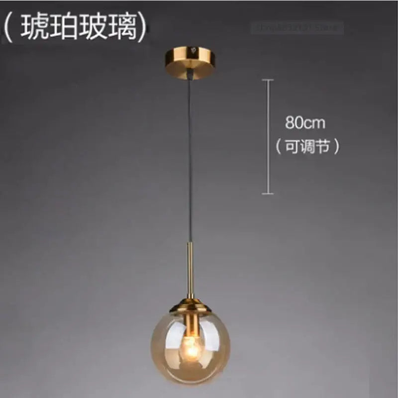 Modern brass glass ball wall lamp featuring a warm amber glass globe with polished brass hardware for bedroom decorbites glass ball