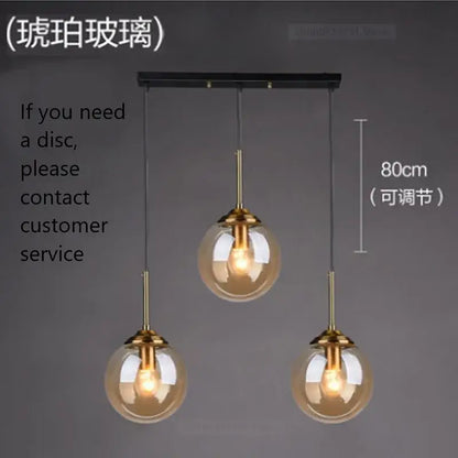 Modern brass glass ball wall lamps featuring three smoked glass globes and brass-finished metal fixtures for decorbites glass ball decor