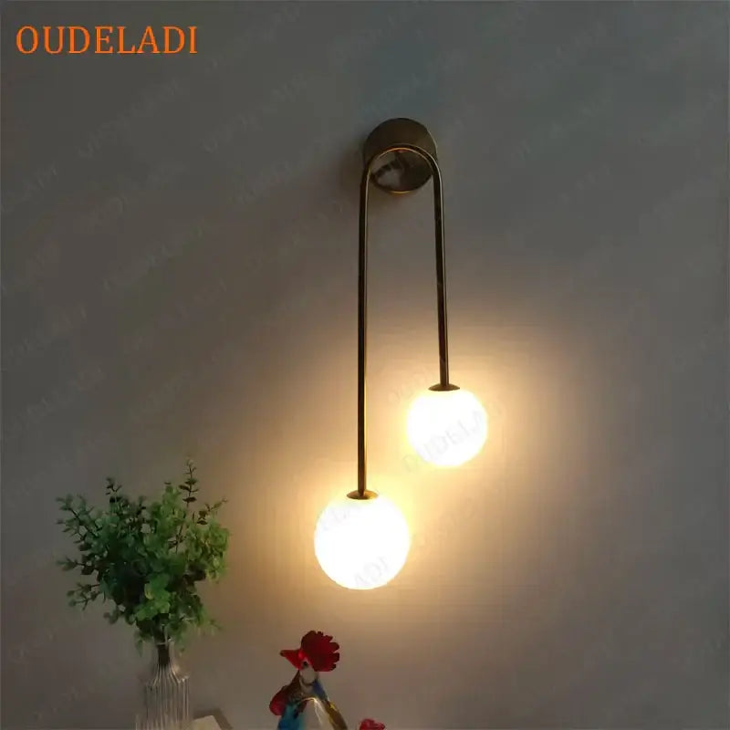 Modern brass glass ball wall sconce with two frosted glass globes for bedroom decorbites brass glass lighting