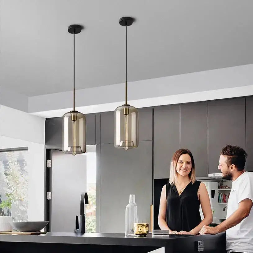 Two modern pendant lights with smoked glass shades and brass fixtures for dining room decorbites glass chandelier